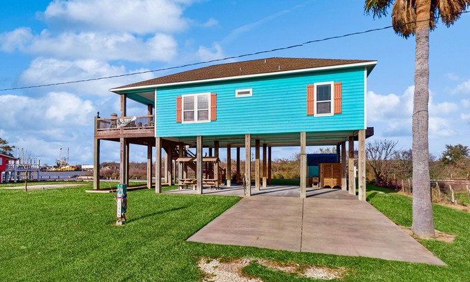 Galveston House | Elegant canal-front home with dock, firepit, deck & kayaks - close to beach