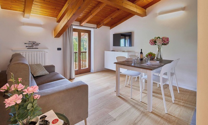 Riva del Garda Apartment | Elegant Top Floor Apartment "Salvia" with Mountain View & Balcony
