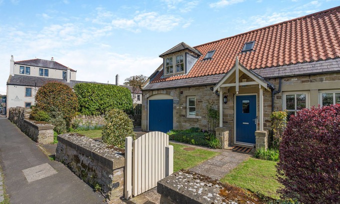 Beadnell Cottage | Embrace Coastal Comforts by the Fire: Your Perfect Retreat Awaits in Beadnell.