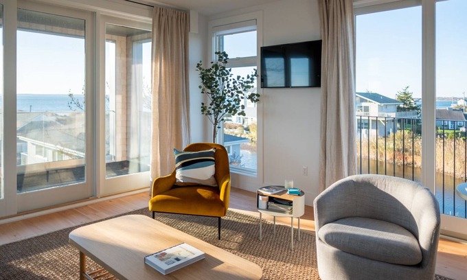 Falmouth House | Enjoy 180 degree views of the Vineyard Sound from this new modern beach house!