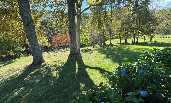 Todd Cabin | Enjoy our picturesque acres and expansive front lawn and beautiful lodge.