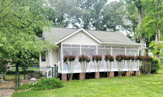 Colonial Beach House | Enjoy the screened side porch, covered front porch, the quick walk to the Beach