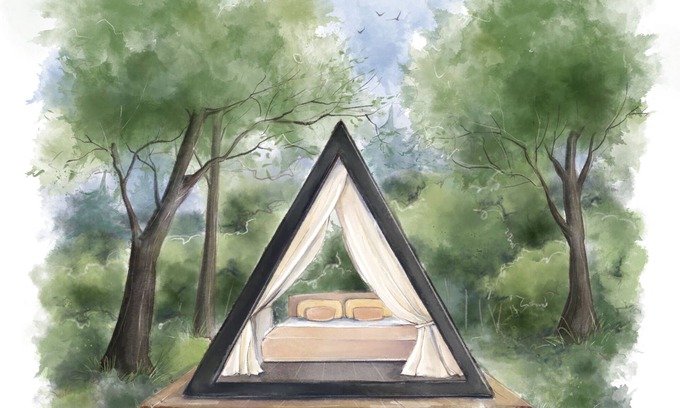 Fennville RV Rental | Enjoy the simplicity and elegance of a cozy bedroom in the woods.