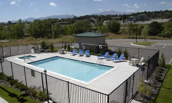Northwest Colorado Springs Condo | Equipped Suite with FREE Breakfast, Outdoor Pool + Gym Access
