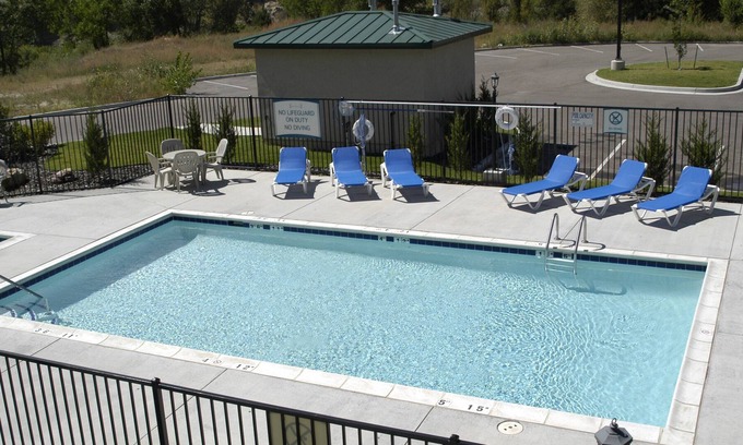 Northwest Colorado Springs Condo | Equipped Suite with Seasonal Outdoor Pool Access! Housekeeping + Business Center