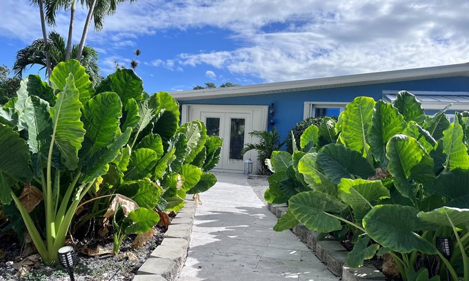 Big Pine Key House | Escape to the Florida Keys to this tropical canal-front home with boat dockage.