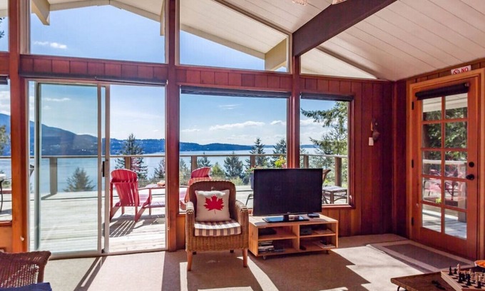 Bowen Island House | Evergreen Cottage · Cheerful oceanview cottage with a fantastic patio