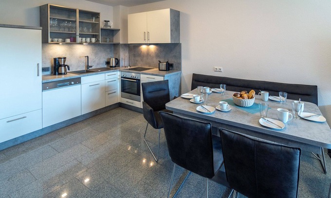 Bensersiel House | Experience an unforgettable vacation by the North Sea in the spacious Domingo vacation home in Bensersiel! This spacious North Sea Oasis house offers around 120 m² of living space and is the ideal retreat for up to 10 people plus a small child. With.