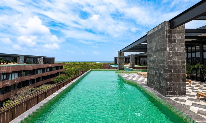 Playa Paraiso Condo | Family-friendly coastal condo with rooftop pool, fire pits & market