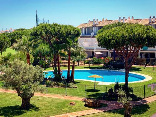 El Portil House | Fantastic 3-Bedroom Holiday Home including Tennis and Pool Near Golf Course