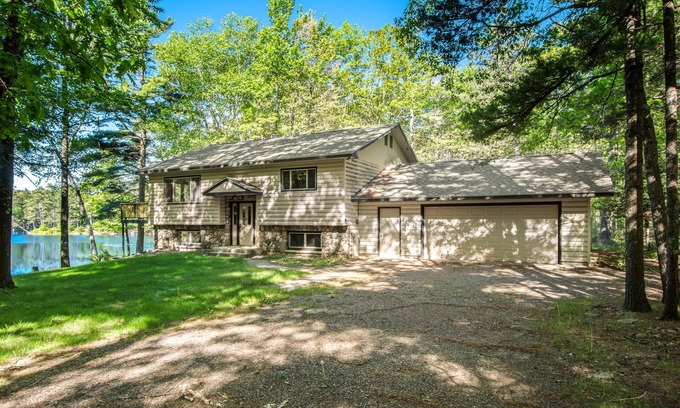 Manitowish Waters House | Fantastic waterfront abode with wraparound deck, dock, & WiFi - dog-friendly