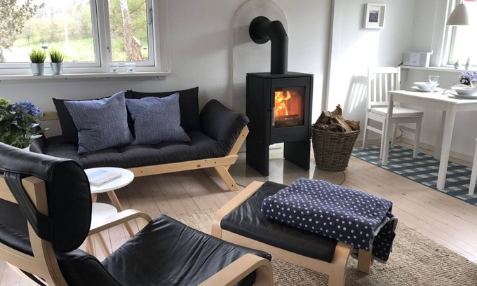 Langballigholz House | Favorite place by the sea - the Blaue Pause vacation home with fireplace and garden.