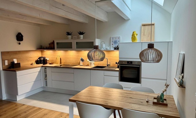 Rysum Apartment | "Fenja" - Cozy maisonette apartment with terrace in the historic courtyard in Rysum -