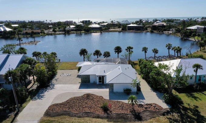 Sanibel House | Five Palms: Coastal Retreat w Private Pool on Lake