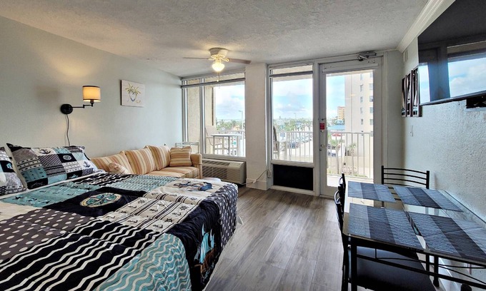 Daytona Beach Shores Condo | FREE DAILY ACTIVITIES! Corner Unit w/Private Balcony to Catch the Action Overlooking City & Ocean!