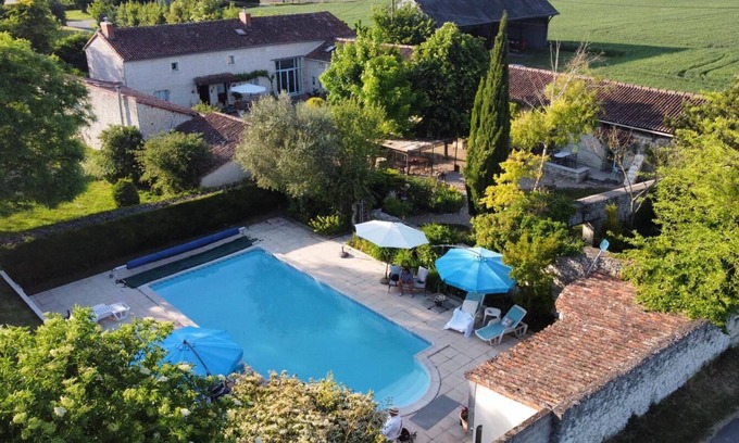 Serigny House | French Gem: Rustic Cottage, Poolside Bliss