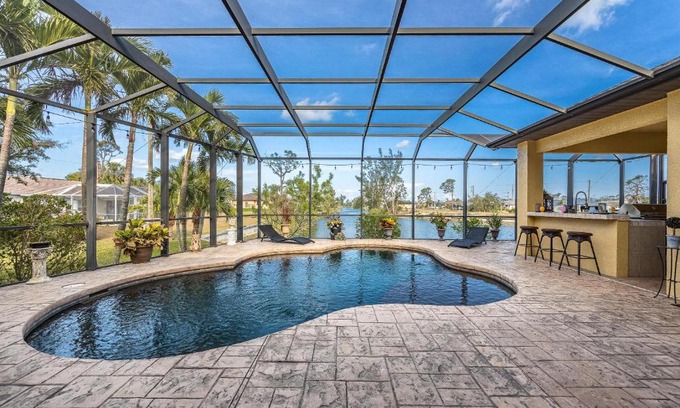 Trafalgar House | Fresh Water Canal, Kayaks, Heated Pool - Villa Windows on the Water - Roelens Vacations