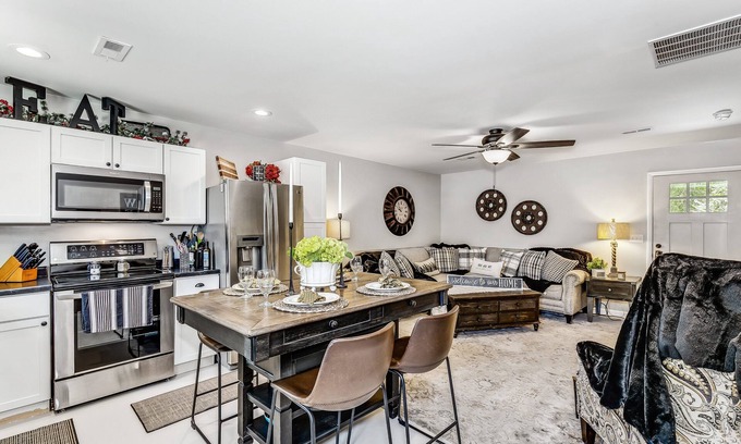 Wichita House | Front door parking, private covered patio with fenced in backyard