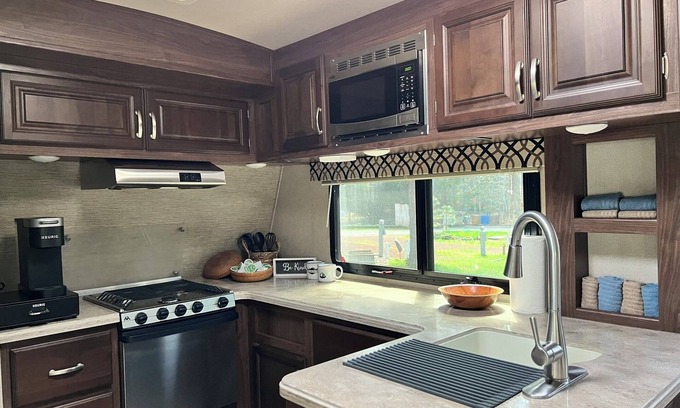 Weed House | Fully Equipped Travel Trailer in beautiful campground setting.