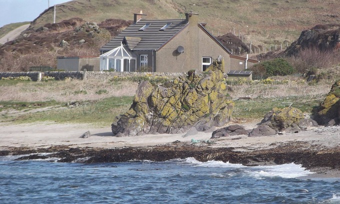 Bellochantuy Cottage | A detached cottage with views across to Gigha and the Paps of Jura.