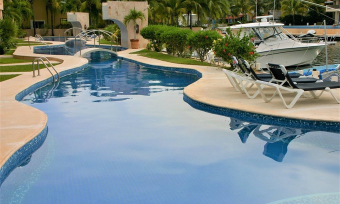 Puerto Aventuras Condo | Gorgeous Ground Level 3 Bed, 3.5 Bath Condo on Marina canal. Sleeps 6