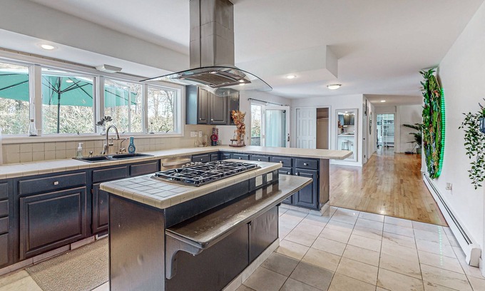 Gardiner House | Gorgeous home with fireplaces, skylights, jetted tubs, library & home gym