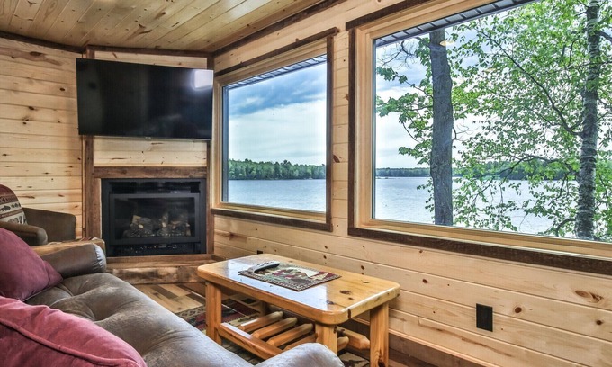 St Germain House | Gorgeous remodeled lakeside cabin with fireplace, personal dock, and sandy beach