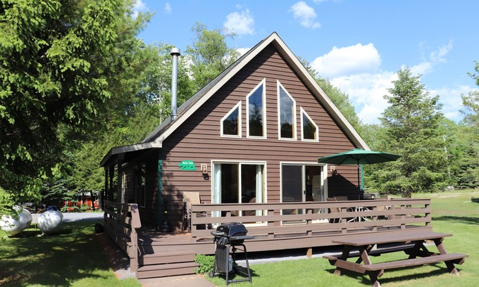 Inlet Cabin | Gorgeous view of the lake from a private deck along with 160 feet of sandy beach