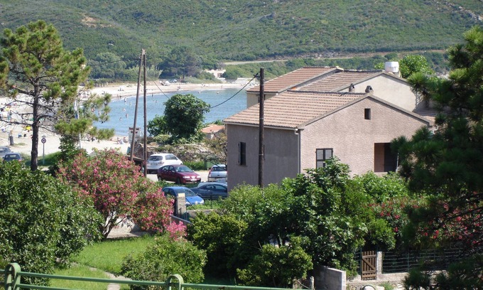 Pietracorbara Apartment | Ground floor Maison Rose 50 metres from the sandy beach