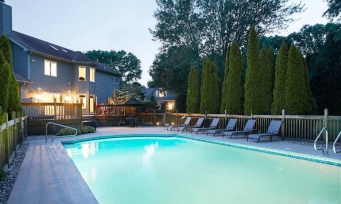 Stevensville House | Guest favorite! Quiet, wooded setting w/heated pool, hot tub, fire pit & more!