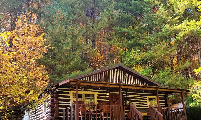 Spruce Pine Cabin | Hand Built Log Cabin Rocking Chair Porch King Bed