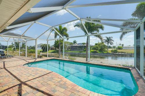 Trafalgar House | Heated Pool and Patio Canal-Front Cape Coral Home!