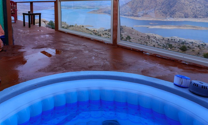 Wofford Heights Cabin | High on a mountainside with a hot tub on a deck.