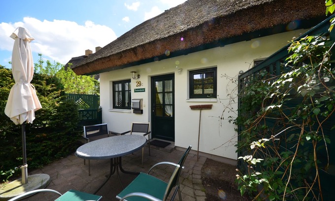 Gross Zicker House | Historical Thatched with a separate entrance with transom windows and shutters