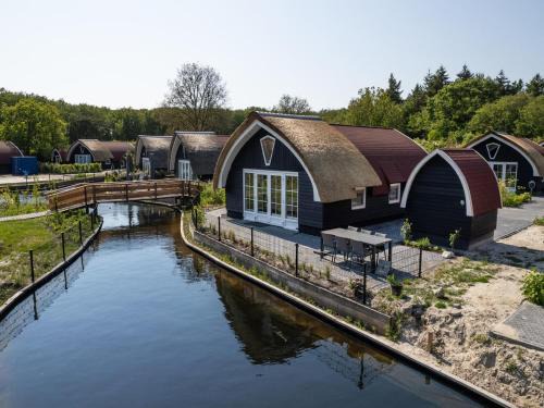 Baars House | Holiday Home in Forest near Pond