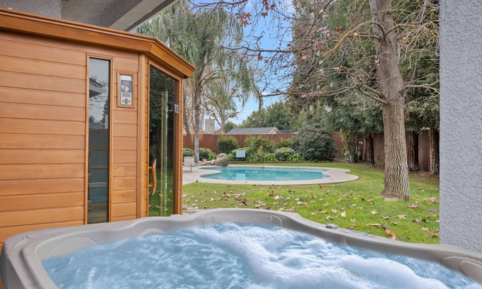 Clovis House | Home oasis with sauna, jacuzzi, pool & heated gazebo!