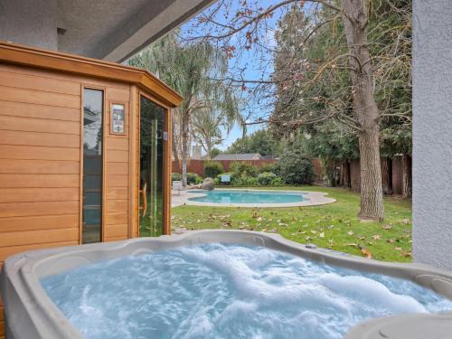Clovis House | Home oasis with sauna, jacuzzi, pool & heated gazebo!