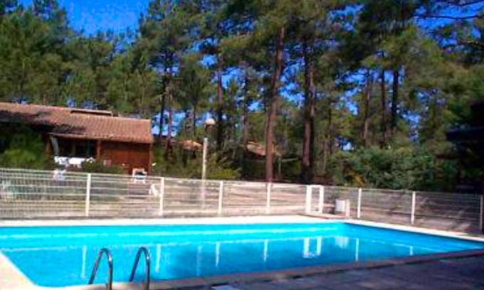 Carcans Ski Chalet | Homerez - Beautiful chalet for 5 ppl. with shared pool and terrace at Carcans