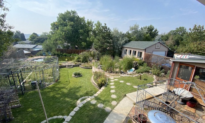 Castle Rock House | Hot tub. Ponds and waterfall and gardens. Sunroom/Man cave.