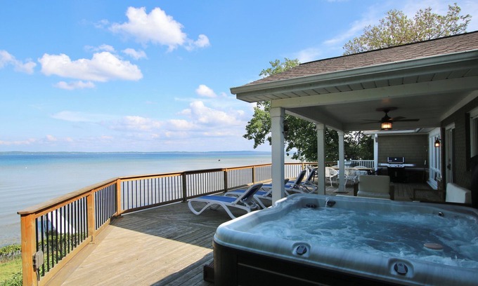 Traverse City House | Hot Tub & West Bay Waterfront Sunrises - All Decked Out