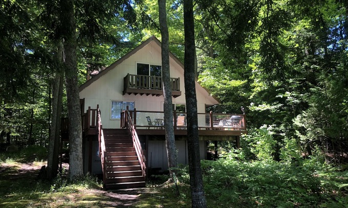 Traverse City House | House on sandy beach in Omena. Budget friendly. Pet ok. Sunrise views.