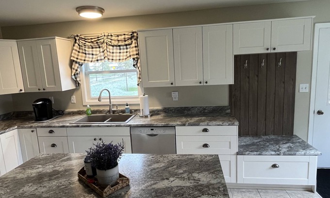 Omro House | Intimate Remodeled Cottage with Fox River View