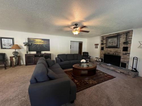 Mount Ida House | JI13- ,A two bedroom, one bath house with den, covered outdoor dining area and fenced in yard at our Joplin Inn home