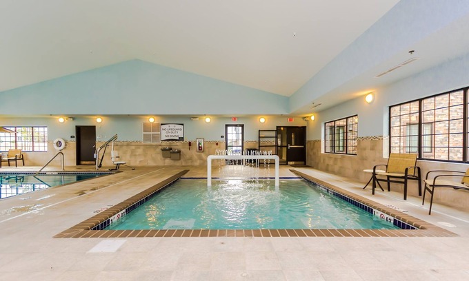 Grand Forks Condo | King Suite Close to University of North Dakota. Free Breakfast. Indoor Pool & Hot Tub.