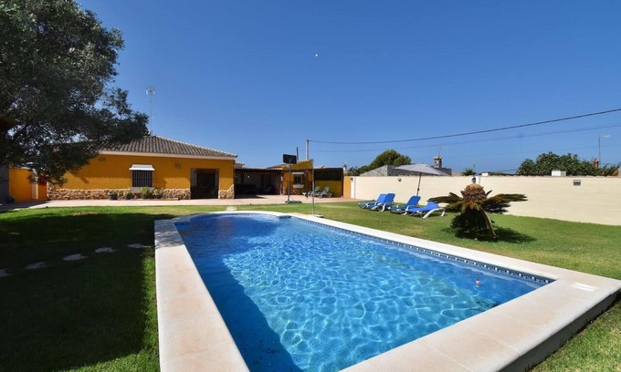 Chiclana de la Frontera Villa | La Casita, rustic has a large garden with swimming pool.