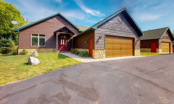 Land O Lakes Condo | Lake-view condo with dock, pool table, grill, deck, patio, wet bar, & streaming