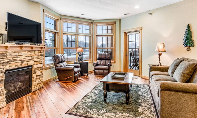 Three Lakes Condo | Lake view condo with 2 balconies, fireplace, pool, hot tubs, gym & sports courts