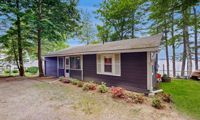 Laconia House | Lakefront cabin with deck, gas grill, kayaks, fireplace, & quick beach access