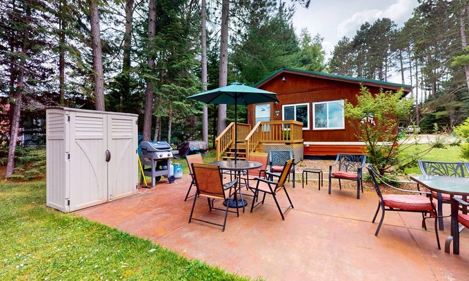 Eagle River House | Lakefront cottage w/a dock, shared furnished patio, firepit, & a paddleboat
