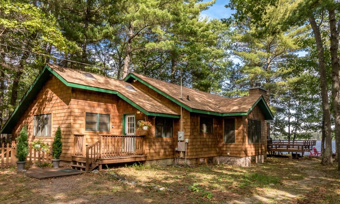 Manitowish Waters House | Lakefront home in a great location with docks, private beach, sauna & firepit